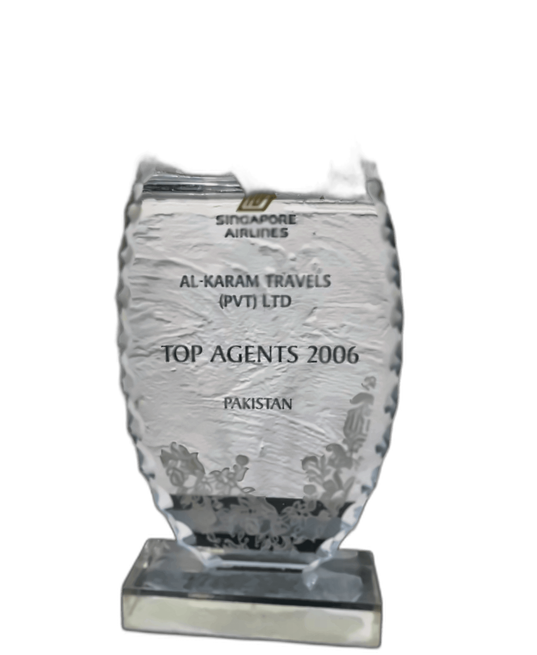 Laser-etched clear crystal glass trophy awarded by Singapore Airlines to Al-Karam Travels (Pvt) Ltd as Top Agents 2006 Pakistan with floral base motifs.